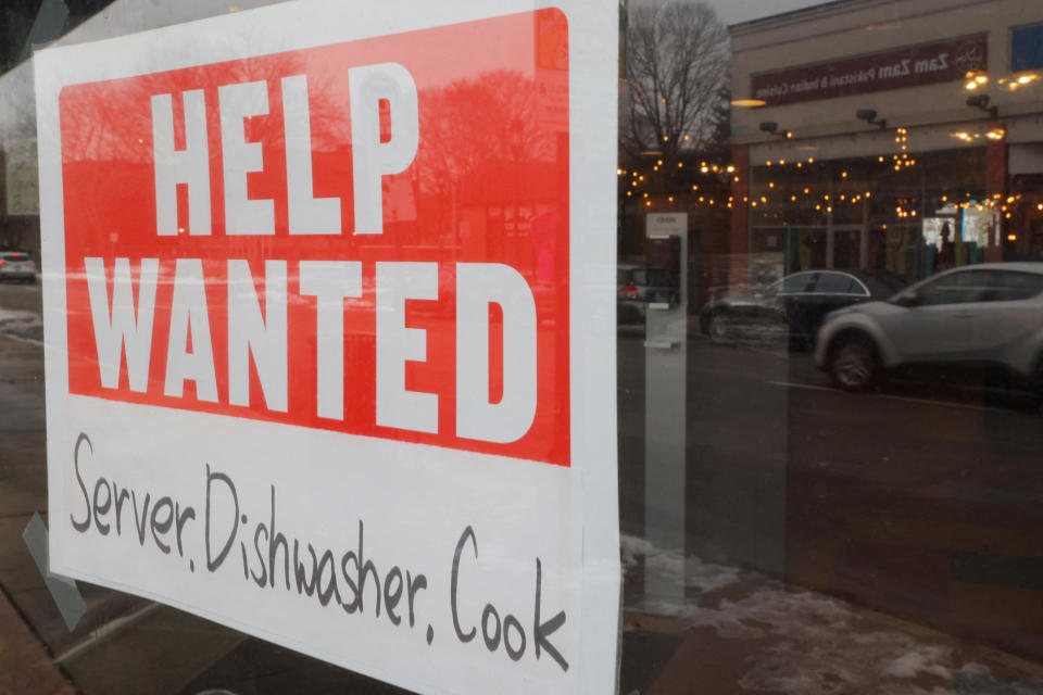 A &#x00201c;Help Wanted&#x00201d; sign hangs in restaurant window in Medford, Massachusetts, U.S., January 25, 2023.     REUTERS/Brian Snyder