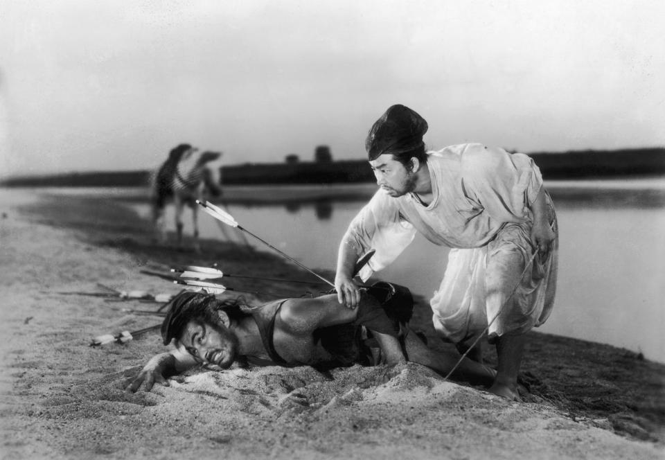 Toshiro Mifune and Daisuke Kato in a fight scene from Akira Kurosawa's 1951 film <em>Rashomon</em><span class="copyright">Hulton Archive/Getty Images</span>