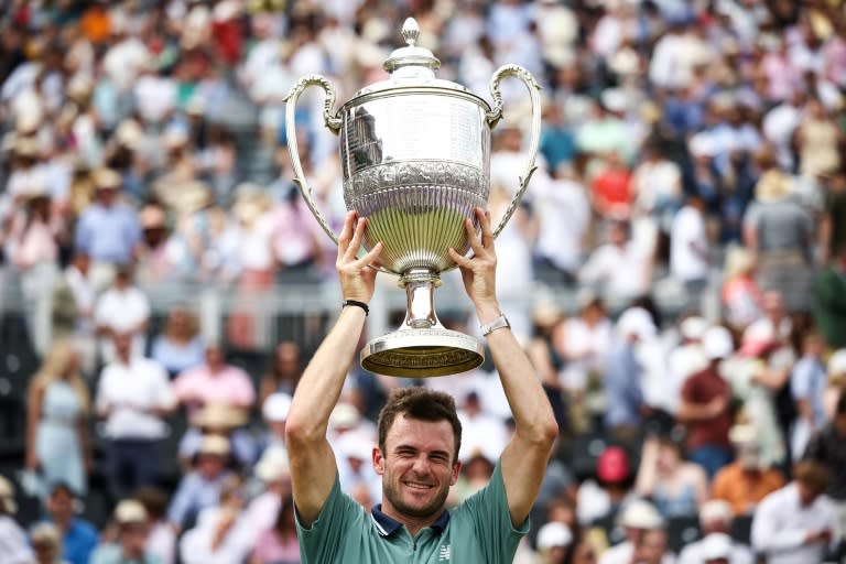 King of Queen's: Tommy Paul of the United States celebrates with the trophy after defeating <a class="link " href="https://sports.yahoo.com/soccer/teams/italy-women/" data-i13n="sec:content-canvas;subsec:anchor_text;elm:context_link" data-ylk="slk:Italy;sec:content-canvas;subsec:anchor_text;elm:context_link;itc:0">Italy</a>'s Lorenzo Musetti in the final of the Queen's Club tennis tournament in London (HENRY NICHOLLS)