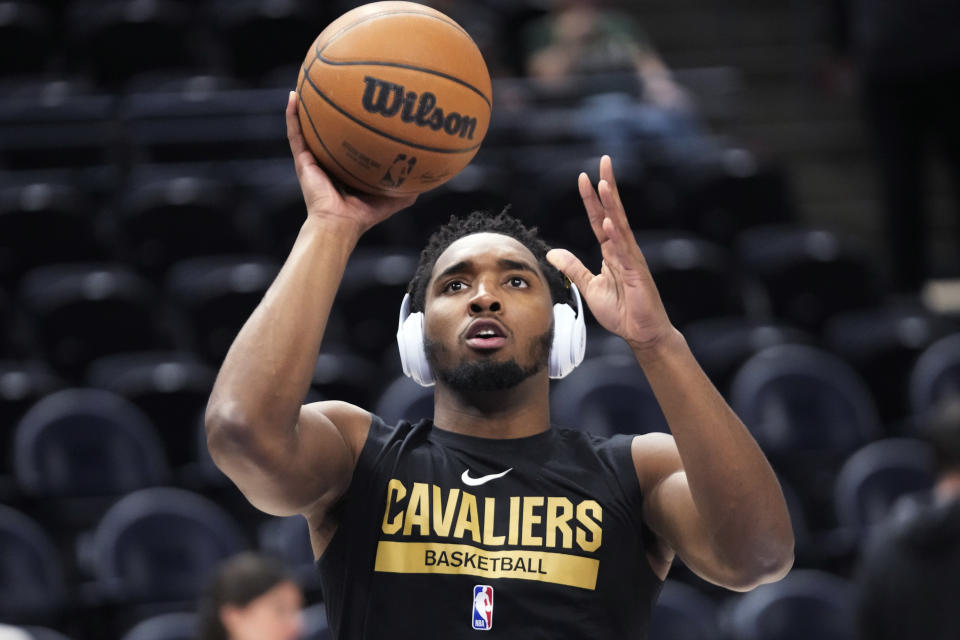 Cleveland Cavaliers guard Donovan Mitchell warms up for the team's NBA basketball game against the Utah Jazz on Tuesday, Jan. 10, 2023, in Salt Lake City. (AP Photo/Rick Bowmer)
