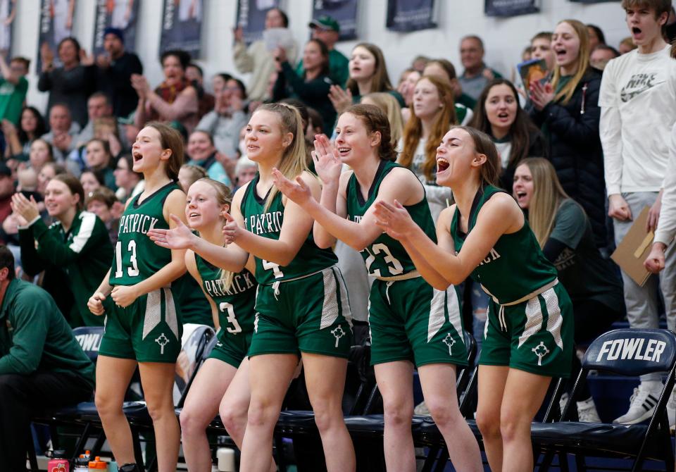 Portland St. Patrick players on the bench celebrate during their game against Fowler, Tuesday, Feb. 1, 2022, in Fowler. St. Patrick won 58-51 in overtime.