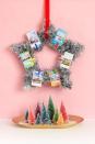 <p>Nothing says celebration like tinsel. This star wreath from <a href="https://thecraftedlife.com/diy-instax-tinsel-wreath/#more-13804" rel="nofollow noopener" target="_blank" data-ylk="slk:The Crafted Life;elm:context_link;itc:0;sec:content-canvas" class="link ">The Crafted Life</a> is easy to replicate—you just need to add your photos. Or you could put out a Polaroid camera at a holiday party and have everyone add their own photos in the moment. </p>