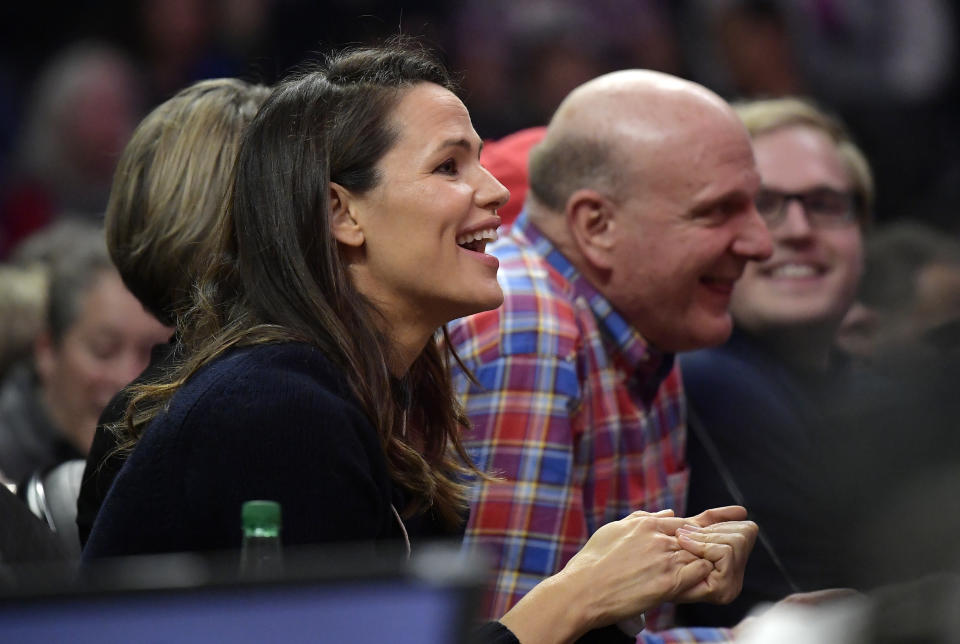 Actress Jennifer Garner, left, watches along with Los Angeles Clippers owner Steve Ballmer during the first half of an NBA basketball game between the Clippers and the Golden State Warriors on Friday, Jan. 18, 2019, in Los Angeles. (AP Photo/Mark J. Terrill)