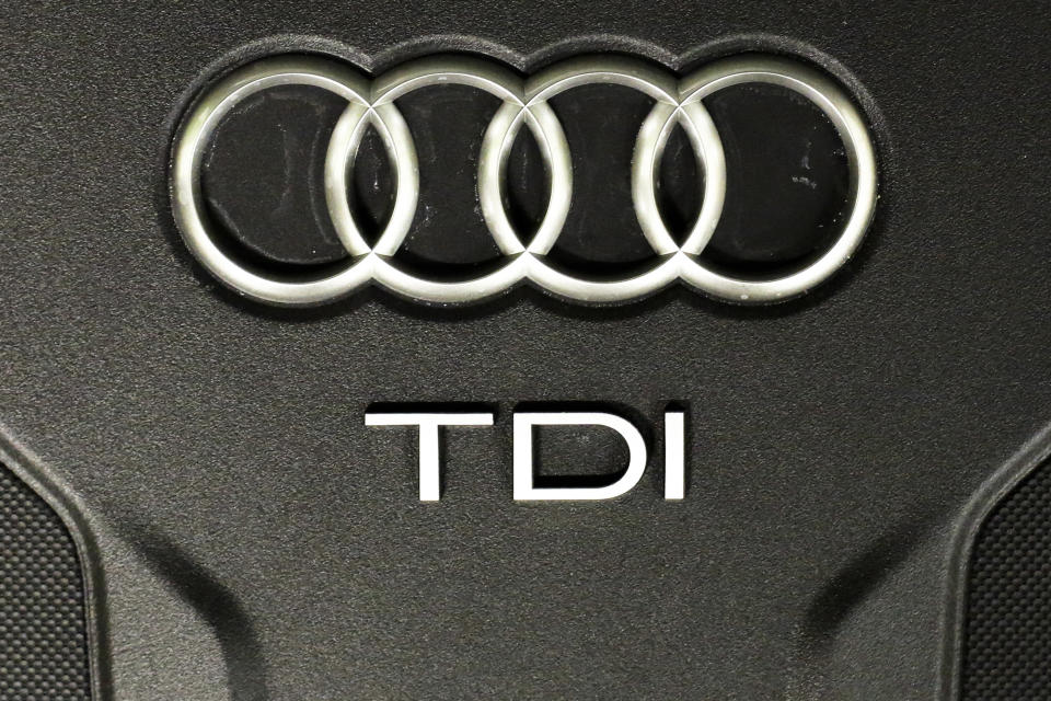 FILE - The Sept. 28, 2015 file photo shows the sign of German car company Audi attached on the engine of a TDI, a turbo diesel model, in Berlin, Germany. Audi accepted a fine of 800 million euro (927 million US$) for it's involvement in the Diesel scandal. (AP Photo/Markus Schreiber, file)