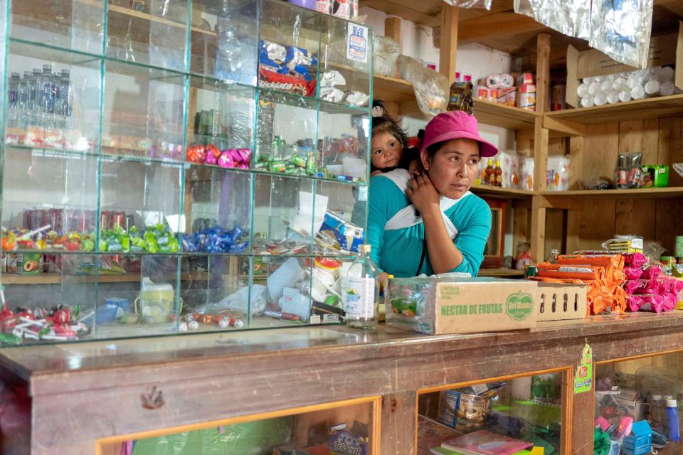 IXCHIGUAN, Guatemala – Cristina Roblero, 33, runs a small store on the first floor of her wood house to earn extra money. Roblero, an indigenous Mayan woman, is considering heading to the U.S. with her three children, including 1-year-old Maddy, to escape extreme poverty in the western highlands of Guatemala.