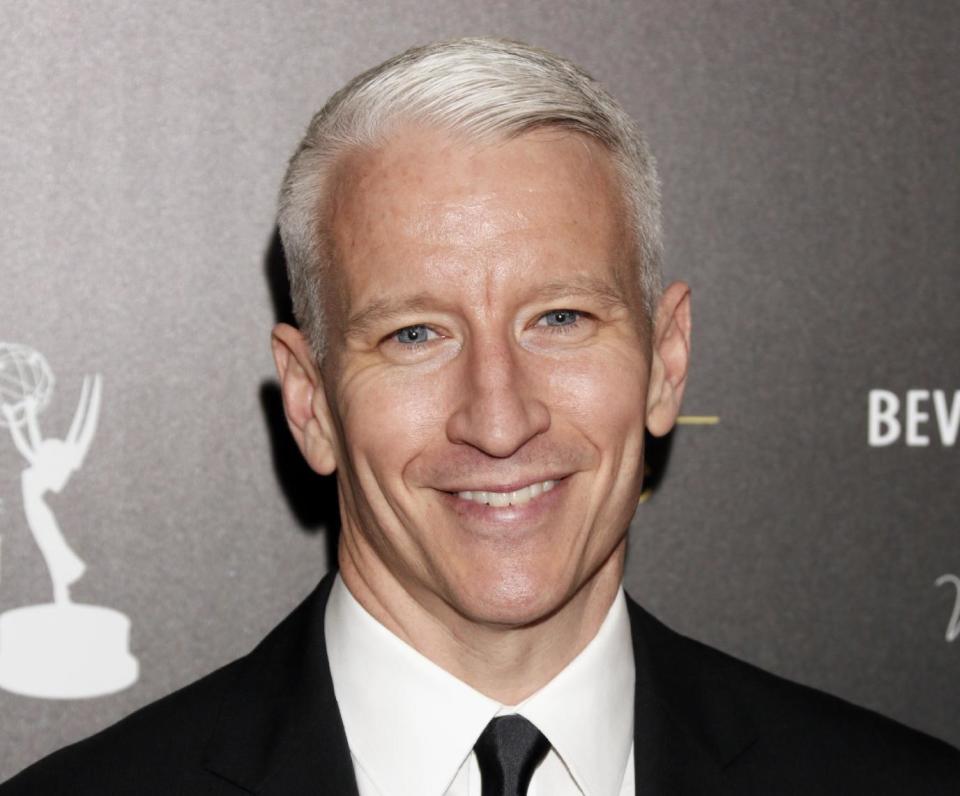 FILE - This June 23, 2012 file photo shows CNN's Anderson Cooper arrives at the 39th Annual Daytime Emmy Awards at the Beverly Hilton Hotel in Beverly Hills, Calif. Cooper came out in a letter online, saying “the fact is, I'm gay.” He said Monday, July 2, in a note to the Daily Beast's Andrew Sullivan that he had kept his sexual orientation private for personal and professional reasons, but came to think that remaining silent had given some people an impression that he was ashamed. (Photo by Todd Williamson/Invision/AP, file)
