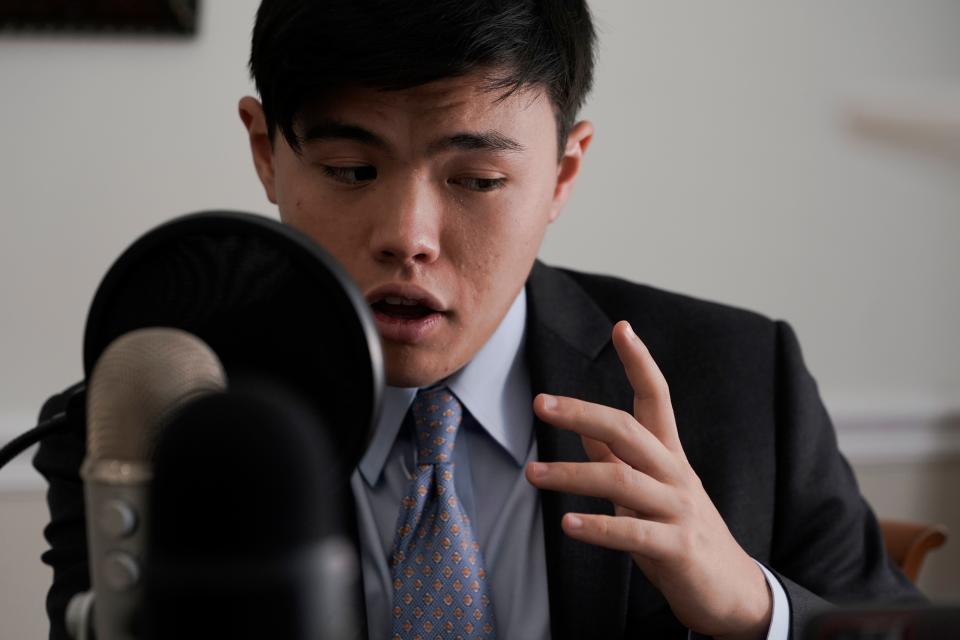 Whitman Ochiai rehearses for his podcast at his home in Great Falls, Virginia, on Aug. 2, 2021.