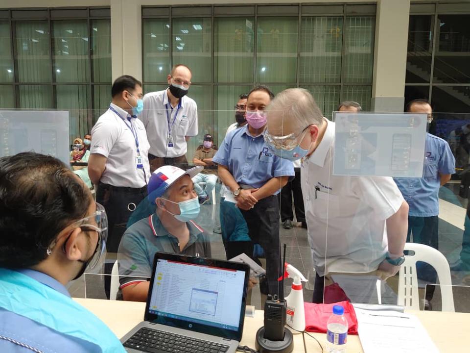 Transport Minister Datuk Seri Wee Ka Siong (right) during his visit to the Industrial Vaccination Centre at the Port of Tanjung Pelepas in Gelang patah, Iskandar Puteri August 3, 2021— Picture by Ben Tan