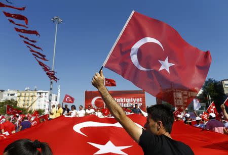 Supporters of various political parties gather in Istanbul's Taksim Square and wave Turkey's national flags during the Republic and Democracy Rally organised by main opposition Republican People's Party (CHP), Turkey, July 24, 2016. REUTERS/Osman Orsal