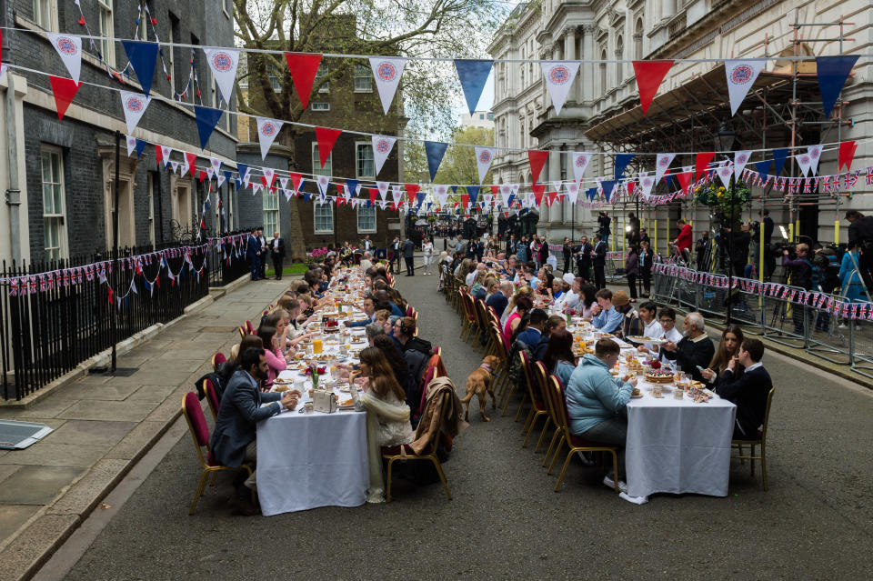 LONDON, UNITED KINGDOM - MAY 07, 2023: Guests attend Coronation Big Lunch outside Downing Street hosted by British Prime Minister Rishi Sunak and his wife Akshata Murty for community heroes, Ukrainian families who have fled war and youth groups in London, United Kingdom on May 07, 2023. The event is taking place as part of The Big Lunch, a nationwide initiative to bring neighbours and communities together to celebrate the Coronation of King Chales III and Queen Camilla with over 50,000 street parities expected to take place in the UK and in countries across the globe. (Photo credit should read Wiktor Szymanowicz/Future Publishing via Getty Images)