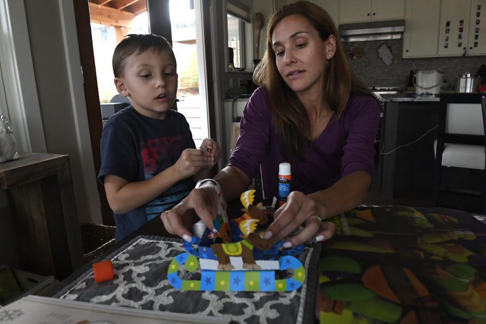 BOULDER, CO - MARCH 3:  Kara Goucher spends time with her 6 year old son Colt at their home on March 3, 2017 near Boulder, Colorado. Kara Goucher is being inducted into the Colorado Running Hall of Fame on Wednesday April 5. This is for her outstanding achievements as a runner but also for the service she and her husband, Adam, did for the sport for blowing the whistle on coach Alberto Salazar, accusing him of doping. They reported him to the U.S. Anti-Doping Agency, which is investigating the allegations. an American long-distance runner. Goucher was the 10,000 meters bronze medalist at the 2007 World Championships in Athletics in Osaka, Japan and represented her country at the 2008 Beijing Olympics and 2012 London Olympics. She competed collegiately for the University of Colorado and was a three-time NCAA champion. (Photo by Helen H. Richardson/The Denver Post via Getty Images)