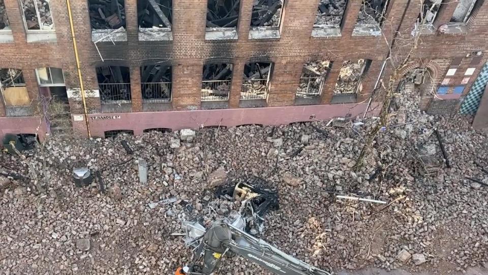 A bobcat was brought in to begin to clear away the mess. Photo: Fire and Rescue NSW