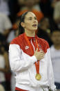 FILE - In this Aug. 23, 2008, file photo, Sue Bird, of the United States, sings the national anthem during the gold medal ceremony for women's basketball at the Beijing 2008 Olympics in Beijing. Sue Bird and Diana Taurasi will try and become the first five-time Olympic gold medalists in basketball as they lead the U.S women's team at the Tokyo Games. The duo was selected for their fifth Olympics on Monday, June 21, 2021, joining Teresa Edwards as the only basketball players in U.S. history to play in five.(AP Photo/Dusan Vranic, File)