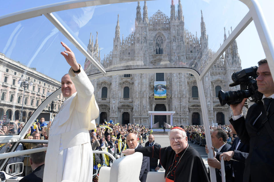 Pope Francis waves as he leaves Milan’s Duomo Cathedral with Cardinal Angelo Scola, sitting at right, after meeting members of the Catholic Church, as part of his one-day pastoral visit to Monza and Milan, Italy’s second-largest city, Saturday, March 25, 2017. Pope Francis began his one-day visit Saturday to the world's largest diocese which included a stop at the city's main prison as well as a blessing at the Gothic-era Duomo cathedral. (L'Osservatore Romano/Pool Photo via AP)