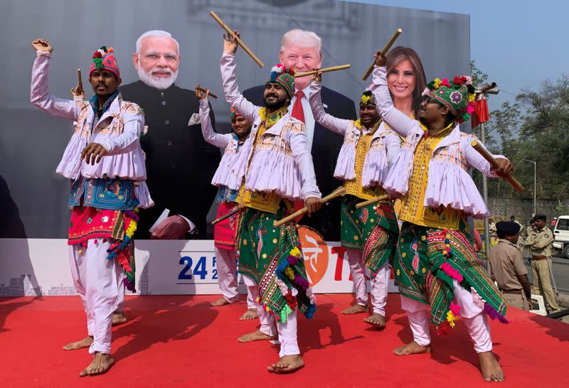 Participants perform Dandiya, a traditional dance, to welcome U.S. President Donald Trump and first lady Melania Trump in Ahmedabad