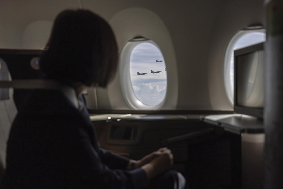 CORRECTS SPELLING OF ESWATINI In this photo released by the Taiwan Presidential Office, Taiwan's President Tsai Ing-wen looks out at F16 fighter jets from the Taiwan Airforce escorting her plane as she leaves for a visit to Eswatini from Taiwan Tuesday, Sept. 5, 2023. Taiwan's President Tsai Ing-wen has begun a four-day trip to Eswatini, one of the island's 13 remaining allies. Tsai, who is serving her last year as president, is visiting the country of 1.1 million people in southern Africa to "celebrate the friendship between the two countries," she said, as she departed Taiwan. (Taiwan Presidential Office via AP)