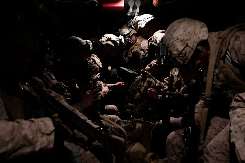 U.S. Marines assigned to Special Purpose Marine Air-Ground Task Force-Crisis Response-Central Command 19.2 prepare to deploy to reinforce Baghdad's U.S. embassy from a base in Kuwait