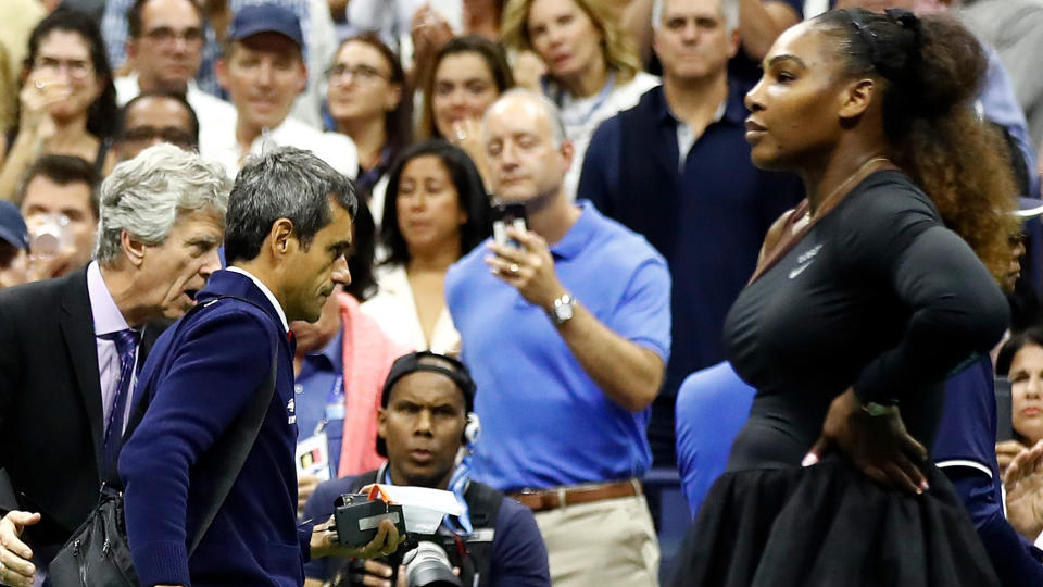 Carlos Ramos leaves the court as Serena watches on. (Photo by Julian Finney/Getty Images)