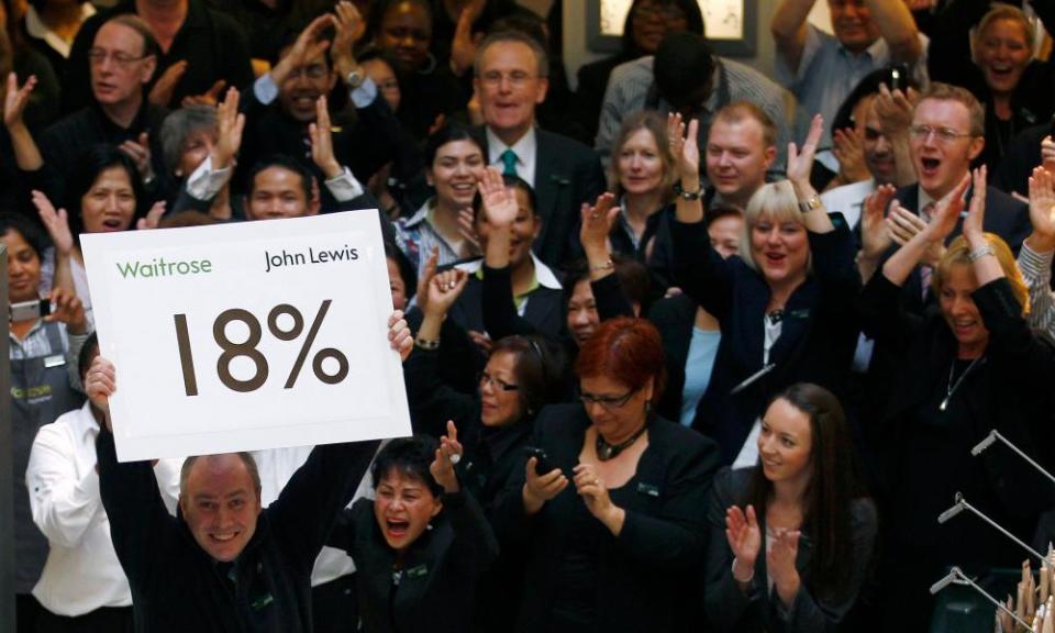 John Lewis staff cheer their 18% bonus in 2011; it is likely to be less than 10% this year.