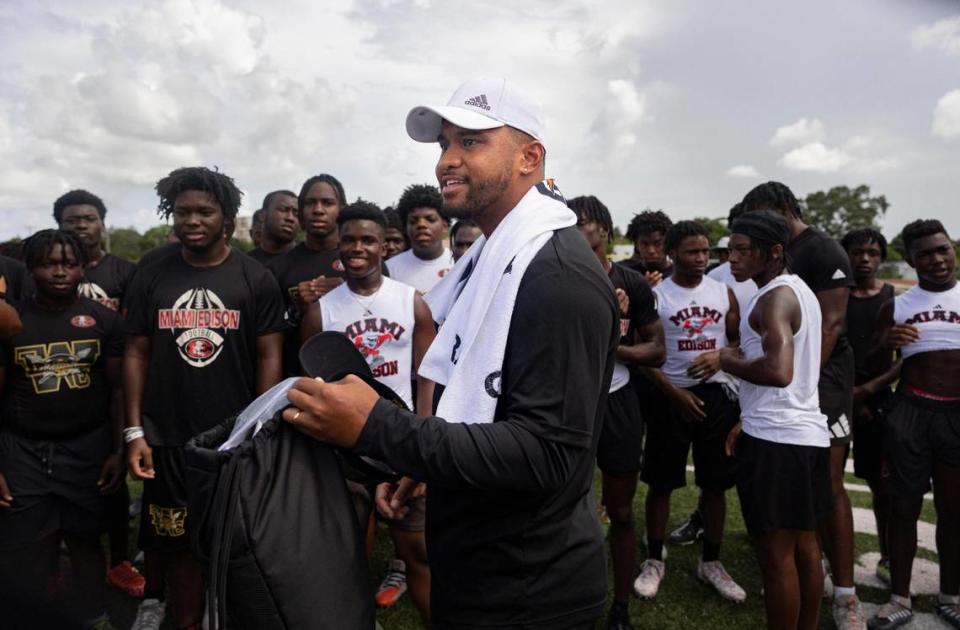 Miami Dolphin’s Tua Tagovailoa talks with the boys football team during practice after school on Tuesday, July 18, 2023, at Miami Edison Senior High. Gatorade’s Equity in Sports partnered with Tagovailoa and Good Sports to bring the Miami Edison new sporting equipment.