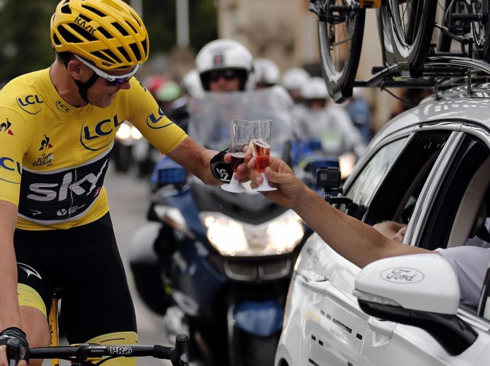 Froome was able to enjoy a glass of champagne during the final stage (Getty)