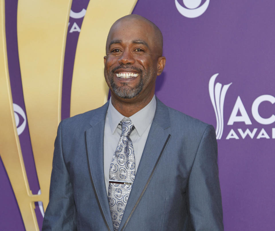 FILE - In this April 1, 2012 file photo, Darius Rucker arrives at the 47th Annual Academy of Country Music Awards in Las Vegas. Rucker was surprised Tuesday night, Oct. 2, 2012 by Brad Paisley, who invited Rucker to become a member of the Grand Ole Opry. (AP Photo/Isaac Brekken, File)