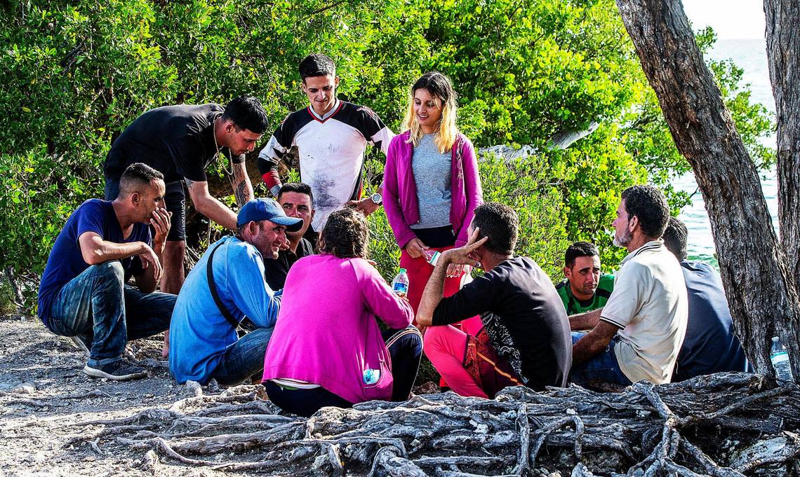 Cuban migrants from Matanzas stand in the sun on the side of U.S. 1 on the Middle Keys island of Duck Key on Jan 2.