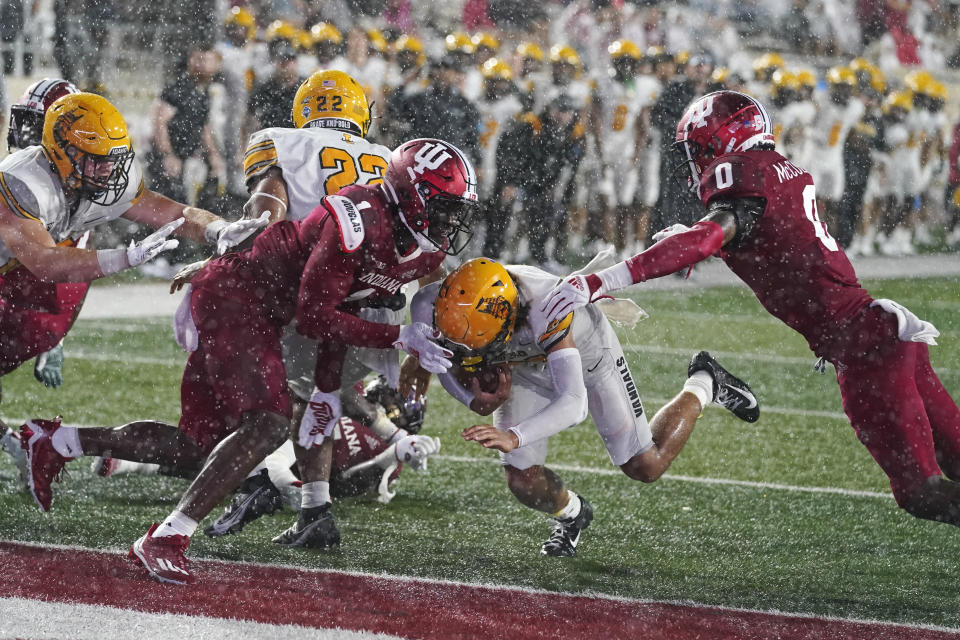 Idaho wide receiver Jordan Dwyer goes in for a touchdown against Indiana defensive back Devon Matthews (1) and linebacker Dasan McCullough (0) during the first half of an NCAA college football game Saturday, Sept. 10, 2022, in Bloomington, Ind. (AP Photo/Darron Cummings)