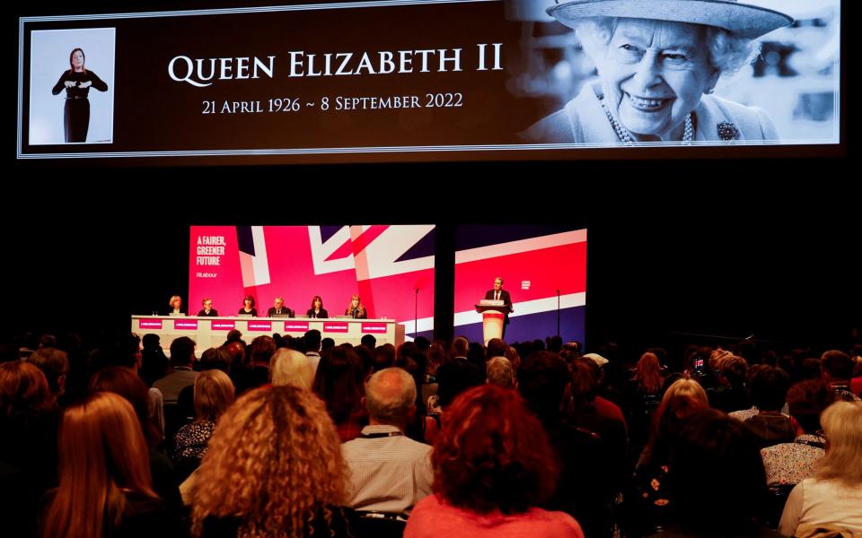 Labour members standing during a minute's silence for the Queen - Phil Noble/Reuters