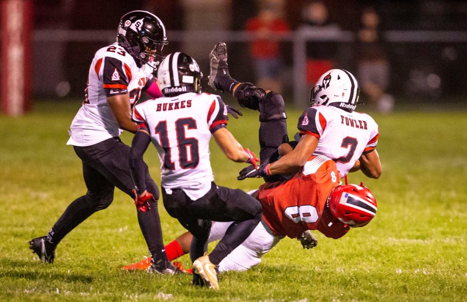 Jacksonville's Cam'Ron Mitchell (8) throws Springfield's Kaleb Fowler (2) to the ground on a rush in the first half at Kraushaar-Rosenberger Field in Jacksonville, Ill., Friday, October 8, 2021. [Justin L. Fowler/The State Journal-Register]