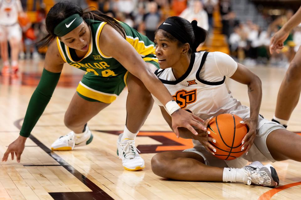 Oklahoma State guard Quincy Noble, right, and Baylor guard Sarah Andrews battle for the ball during Sunday's game at Gallagher-Iba Arena in Stillwater.