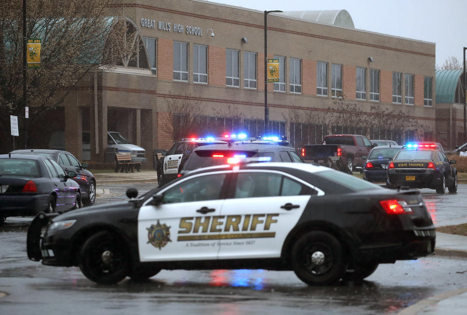 Police vehicles are parked in front of Great Mills High School after a shooting on March 20, 2018 in Great Mills, Maryland.&nbsp;
