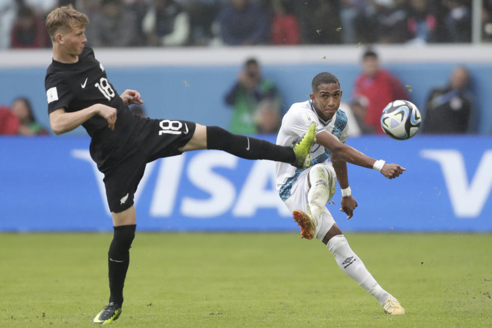 Guatemala's Figo Montano, right, kicks the ball past New Zealand's Benjamin Wallace during a FIFA U-20 World Cup Group A soccer match at the Santiago del Estero Stadium in Santiago del Estero, Argentina, Saturday, May 20, 2023. (AP Photo/Nicolas Aguilera)