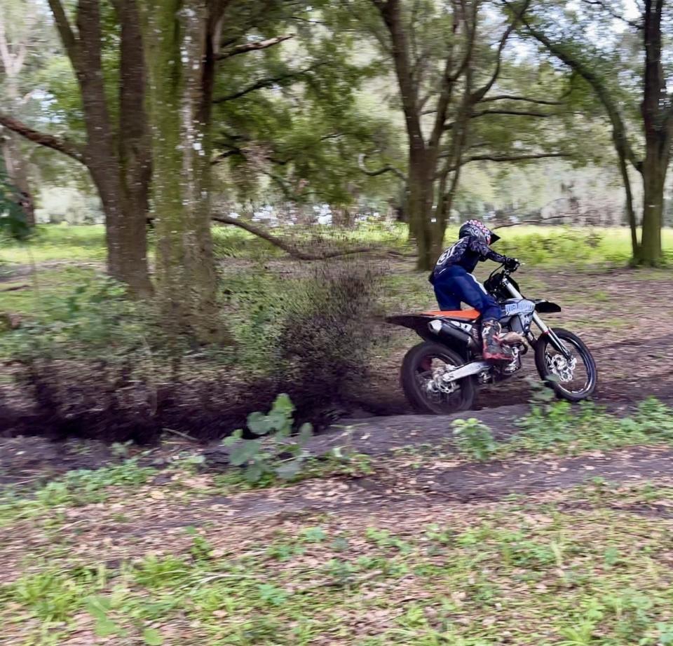 Logan Mortberg, 16, of Pierson, kicks up dirt as he practices making turns faster during training at a private motocross track Sept. 12. Mortberg placed fourth in the Loretta Lynn Amateur National Motocross Championship in Tennessee.