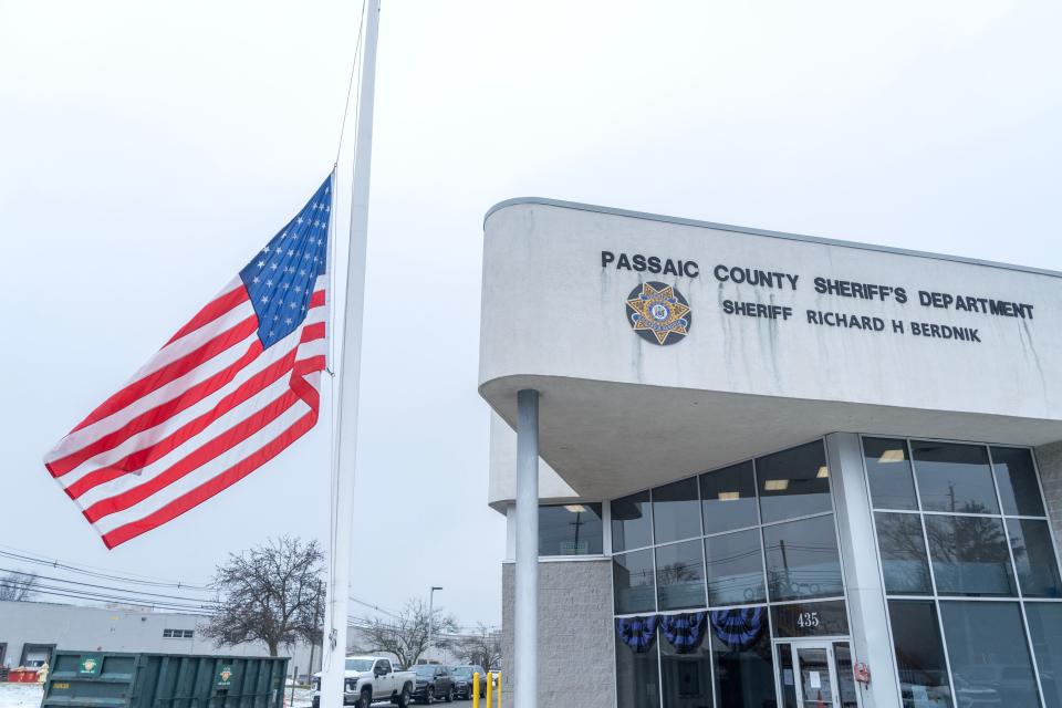 After the death of Passaic County Sheriff Richard Berdnik, the American flag was lowered to half staff and purple bunting hangs from the entrance of the Passaic County Sheriff Department building in Wayne, NJ on Wednesday Jan. 24, 2024.