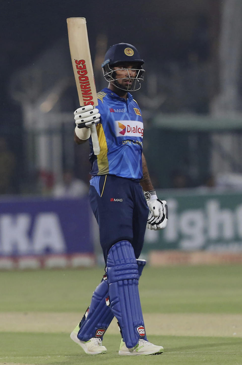 Sri Lankan batsman Danushka Gunathilaka acknowledges his fifty against Pakistan during 1st Twenty20 match at Gaddafi stadium in Lahore, Pakistan, Saturday, Oct. 5, 2019. (AP Photo/K.M. Chaudary)