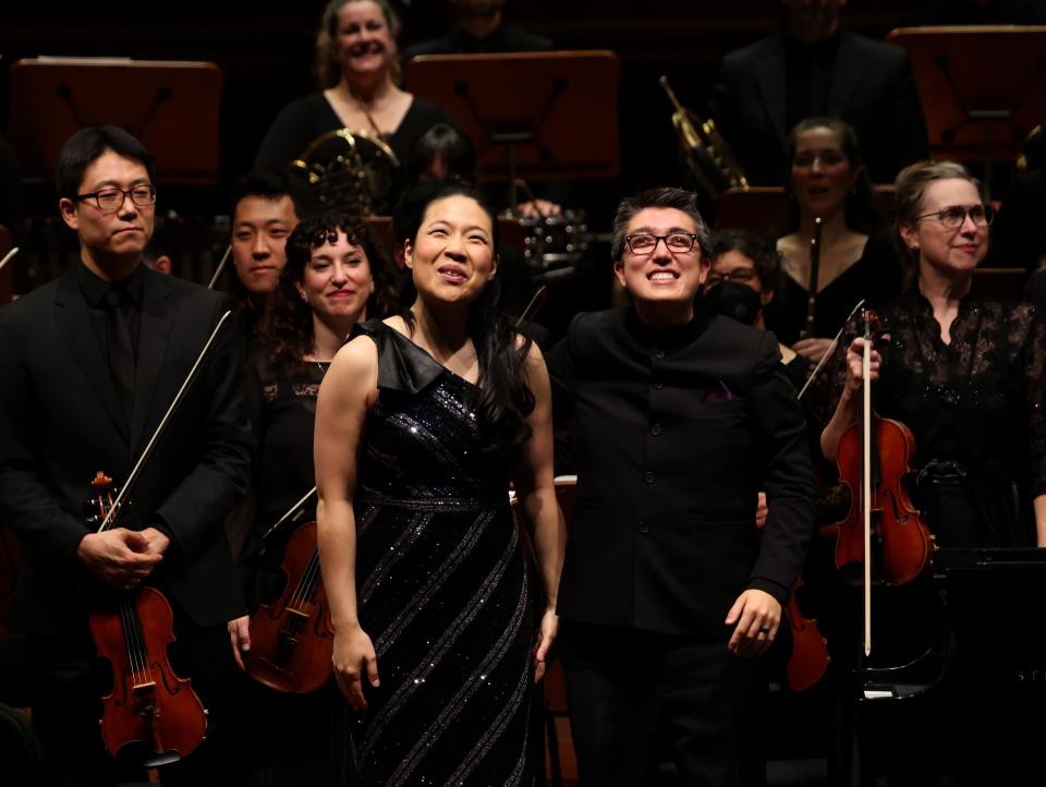 Pianist Joyce Yang and conductor Ryan Tani enjoy the applause during Milwaukee Symphony Orchestra's Nov. 11 concert at the Bradley Symphony Center.