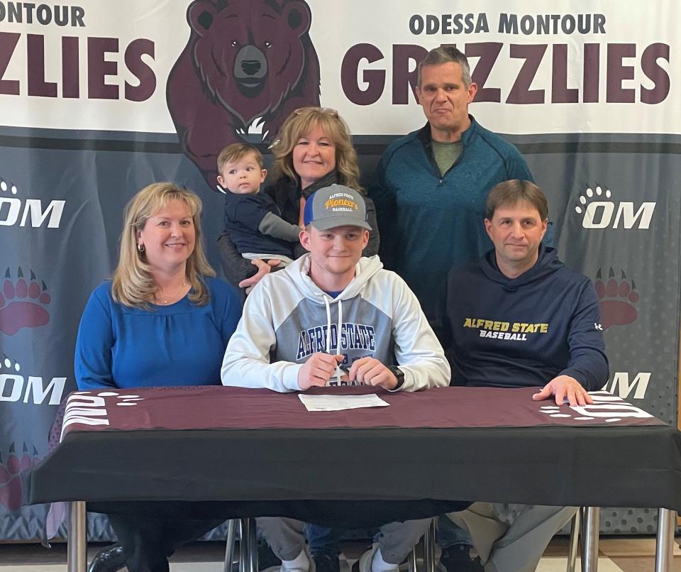 Odessa-Montour senior Daniel Lewis, front center, during a signing celebration at O-M on March 9, 2023. Lewis signed to play baseball at Alfred State.