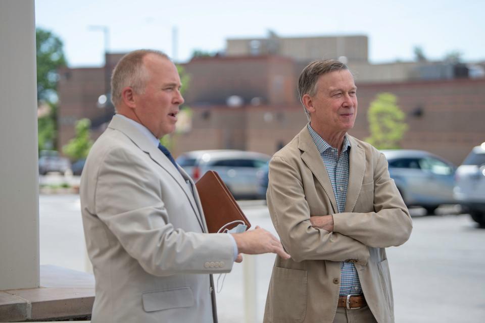 Donald Moore, chief executive officer for Pueblo Community Health Center, (left) led U.S. Sen. John Hickenlooper on a tour of the new East Side clinic on June 28, 2022.