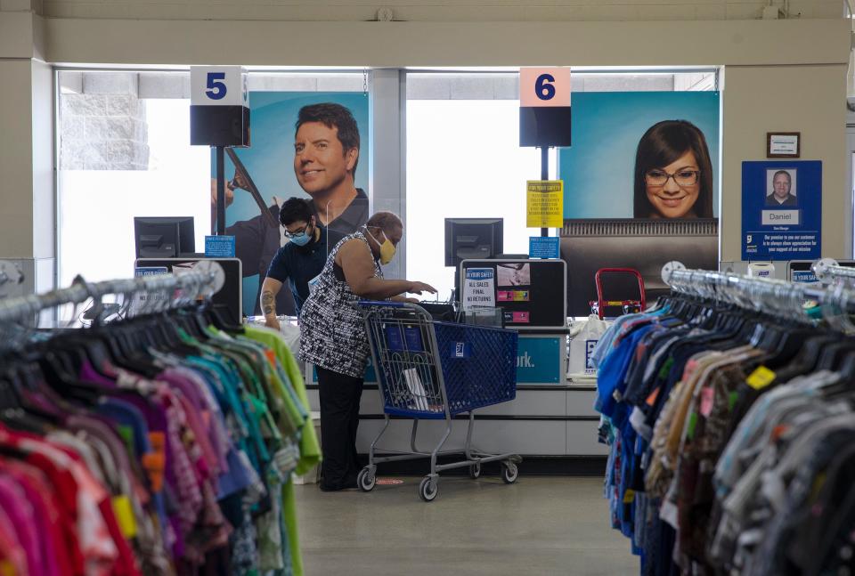 A customer checks out in a Goodwill store on Friday, May 15, 2020 in Waukesha, Wisconsin.