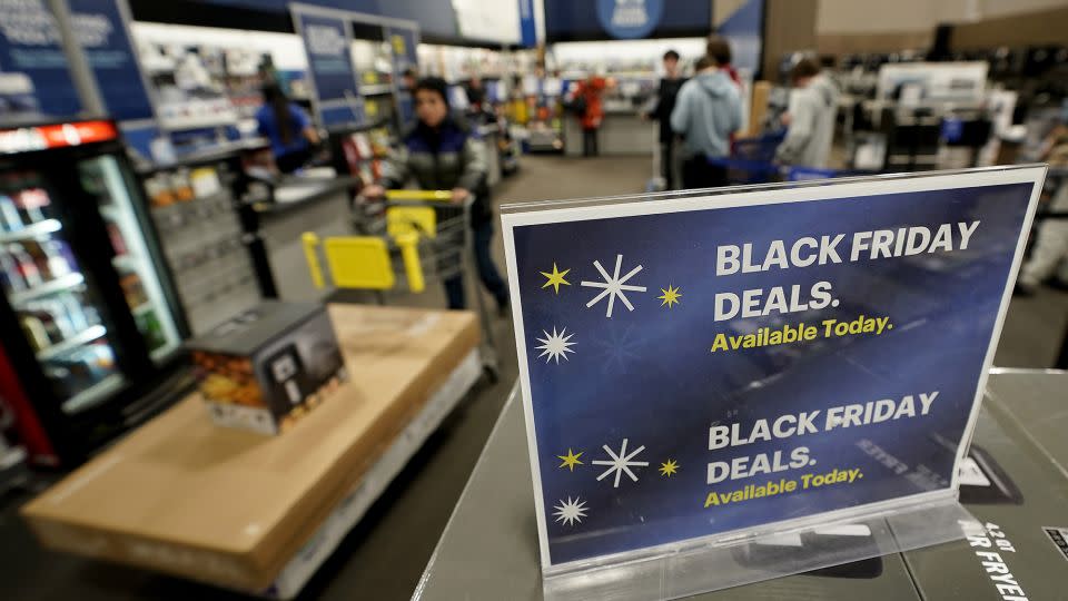 Shoppers should expect enticing deals on TVs, laptops and iPhones on Black Friday. - Charlie Riedel/AP