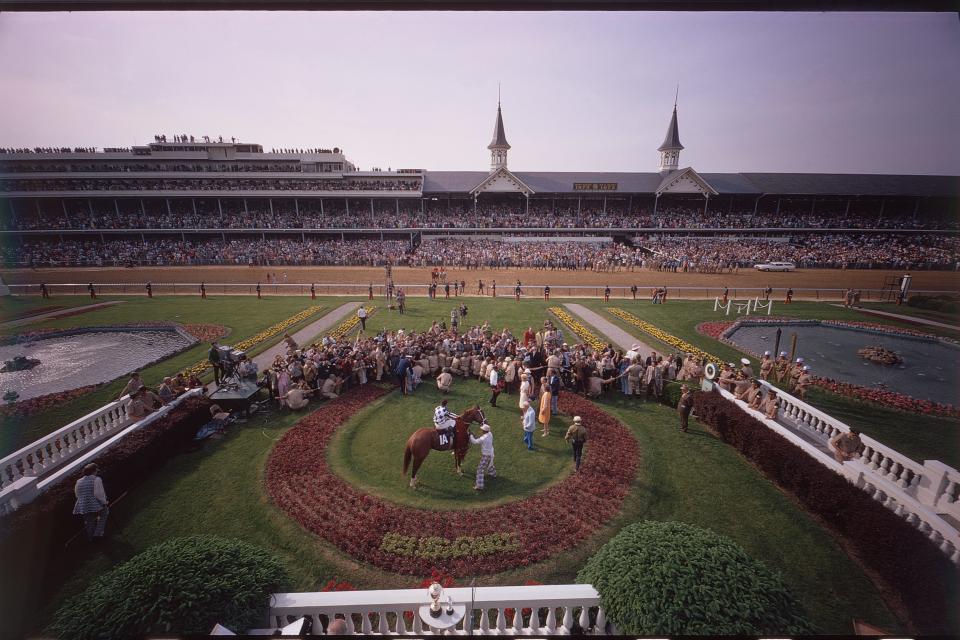 Secretariat poses for photos in the winner’s circle after his victory in the 1973 Kentucky Derby.