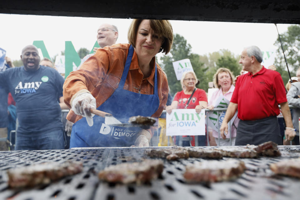 Democratic presidential candidate Sen. Amy Klobuchar works the grill during the Polk County Democrats Steak Fry, Saturday, Sept. 21, 2019, in Des Moines, Iowa. (AP Photo/Charlie Neibergall)