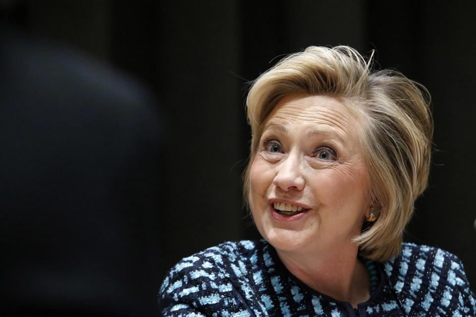 Former U.S. Secretary of State Hillary Clinton attends an International Women's Day event at the U.N. headquarters in New York, March 7, 2014. On March 8 activists around the globe celebrate International Women's Day, which dates back to the beginning of the 20th Century and has been observed by the United Nations since 1975. The UN writes that it is an occasion to commemorate achievements in women's rights and to call for further change. REUTERS/Eduardo Munoz (UNITED STATES - Tags: POLITICS)