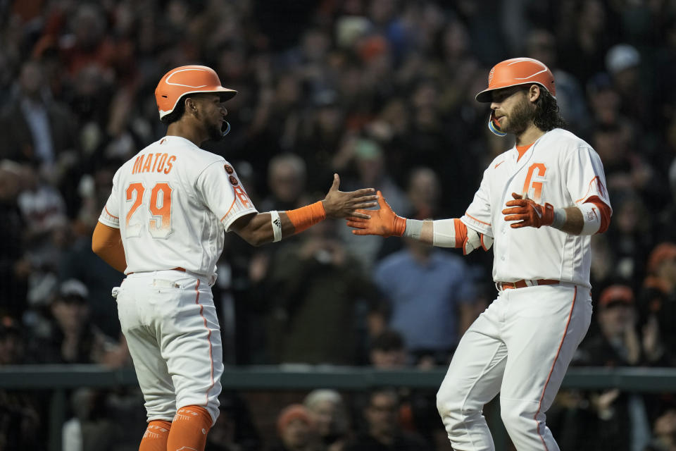 San Francisco Giants' Brandon Crawford, right, celebrates with Luis Matos after hitting a two-run home run against the Arizona Diamondbacks during the sixth inning of a baseball game Tuesday, Aug. 1, 2023, in San Francisco. (AP Photo/Godofredo A. Vásquez)