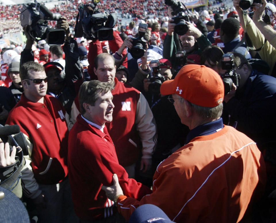 Jan 1, 2007; Dallas, TX, USA; Nebraska Cornhuskers head coach Bill Callahan meets with <a class="link " href="https://sports.yahoo.com/ncaaw/teams/auburn/" data-i13n="sec:content-canvas;subsec:anchor_text;elm:context_link" data-ylk="slk:Auburn Tigers;sec:content-canvas;subsec:anchor_text;elm:context_link;itc:0">Auburn Tigers</a> head coach Tommy Tuberville after the Tigers beat the Cornhuskers 17-14 at the AT&T Cotton Bowl in Dallas, TX. Mandatory Credit: Photo By John Reed-USA TODAY Sports