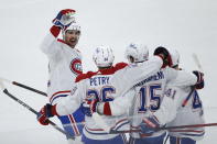 Montreal Canadiens' Jesperi Kotkaniemi (15) celebrates his goal against the Winnipeg Jets with Erik Gustafsson (32), Jeff Petry (26) and Paul Byron (41) during the first period of Game 1 of an NHL hockey Stanley Cup second-round playoff series Wednesday, June 2, 2021, in Winnipeg, Manitoba. (John Woods/The Canadian Press via AP)