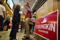 Virginia Republican gubernatorial candidate Glenn Youngkin greets a supporter during a meet and greet at a sports bar in Chesapeake, Va., Monday, Oct. 11, 2021. Youngkin faces former Governor Terry McAuliffe in the November election. (AP Photo/Steve Helber)