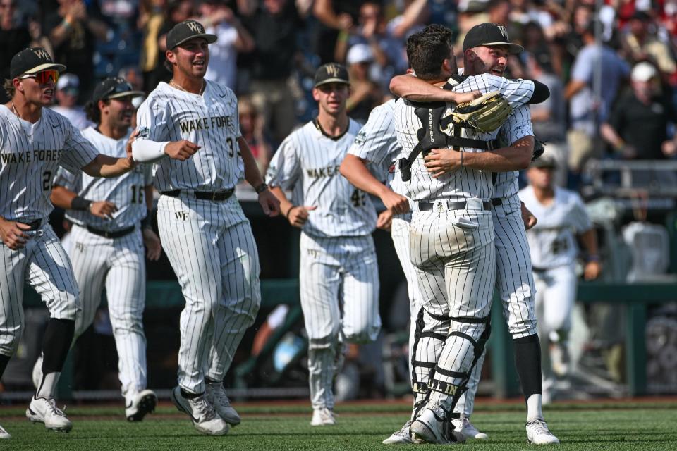 Wake Forest players celebrate after defeating during the 2023 College World Series at Charles Schwab Field in Omaha, Neb.