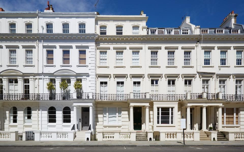 White luxury houses facades in London, Kensington and Chelsea - iStock